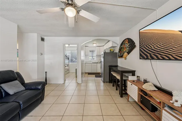 a living room with furniture and a table