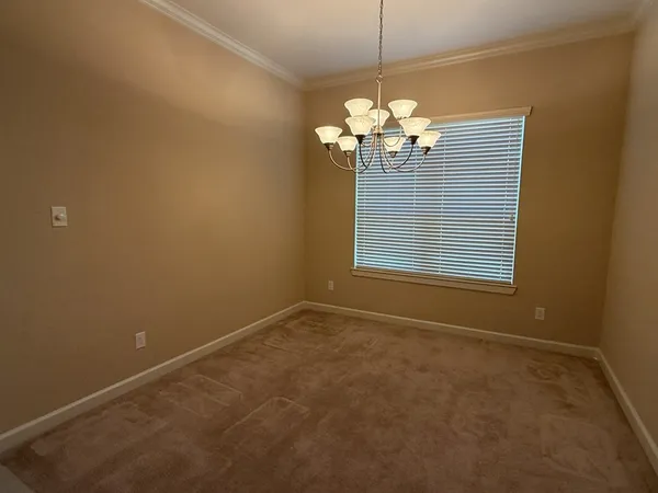 a view of a chandelier fan and a chandelier