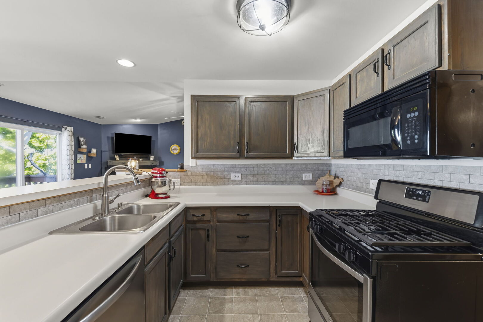 965 Constance Lane, Unit G Sycamore, IL 60178 - Photo 14 of 25 a kitchen that has a sink and a stove