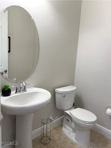 a view of a sink and washer dryer