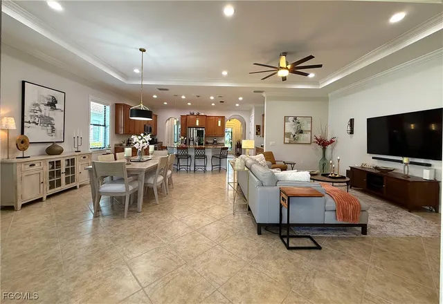 a kitchen with granite countertop a refrigerator stove top oven and sink