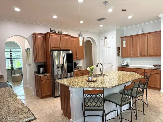 a kitchen with a table and chairs in it