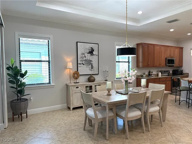 a view of a dining room with furniture window and outside view