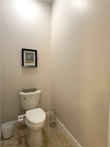 a living room with furniture and floor to ceiling windows