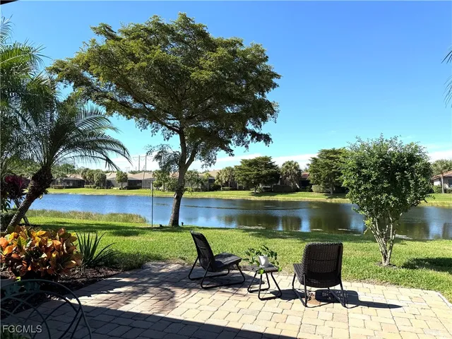 a view of a lake with a yard