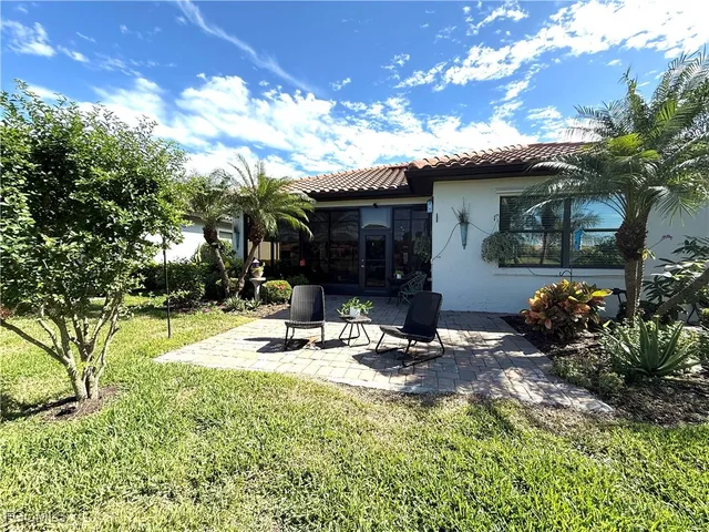 a view of a lake with houses in the back