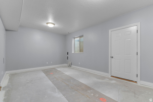 1501 West Elk Circle Mapleton, UT 84664 - Photo 38 of 39 Spacious room with light gray walls, a window featuring horizontal blinds, and a white paneled door with brushed nickel hardware