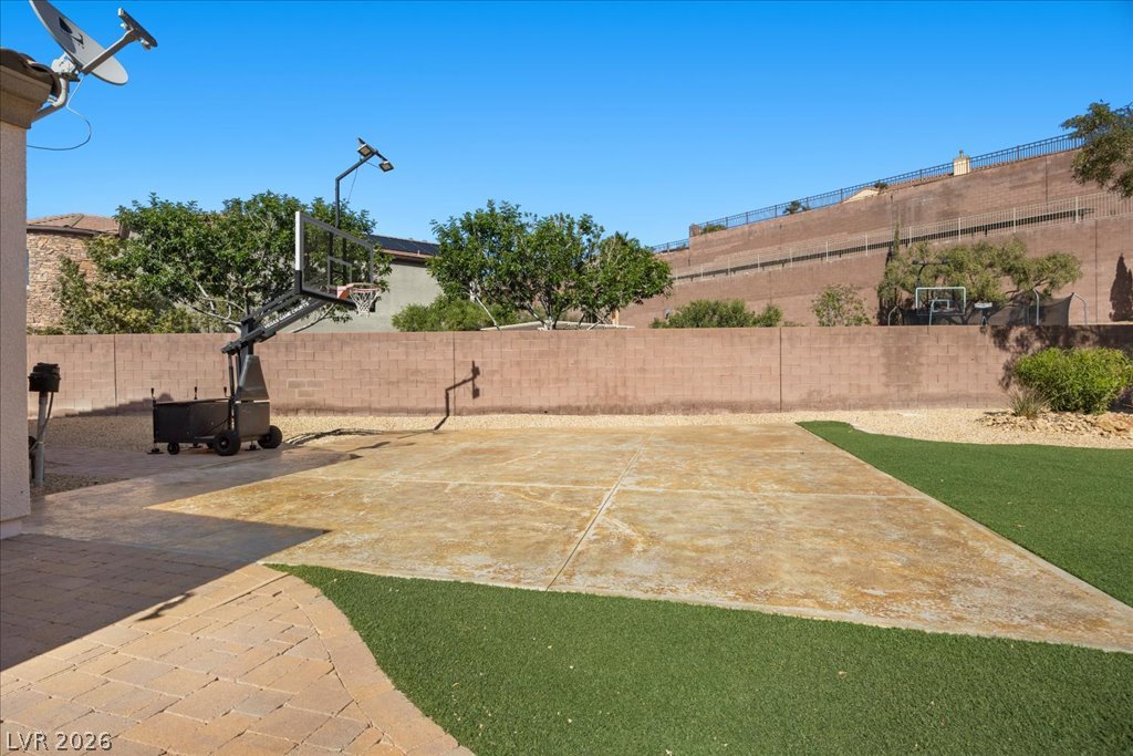 2125 De Rouge Avenue Henderson, NV 89044 - Photo 81 of 96 An outdoor court and artificial turf combine for a private, low-maintenance recreational space.