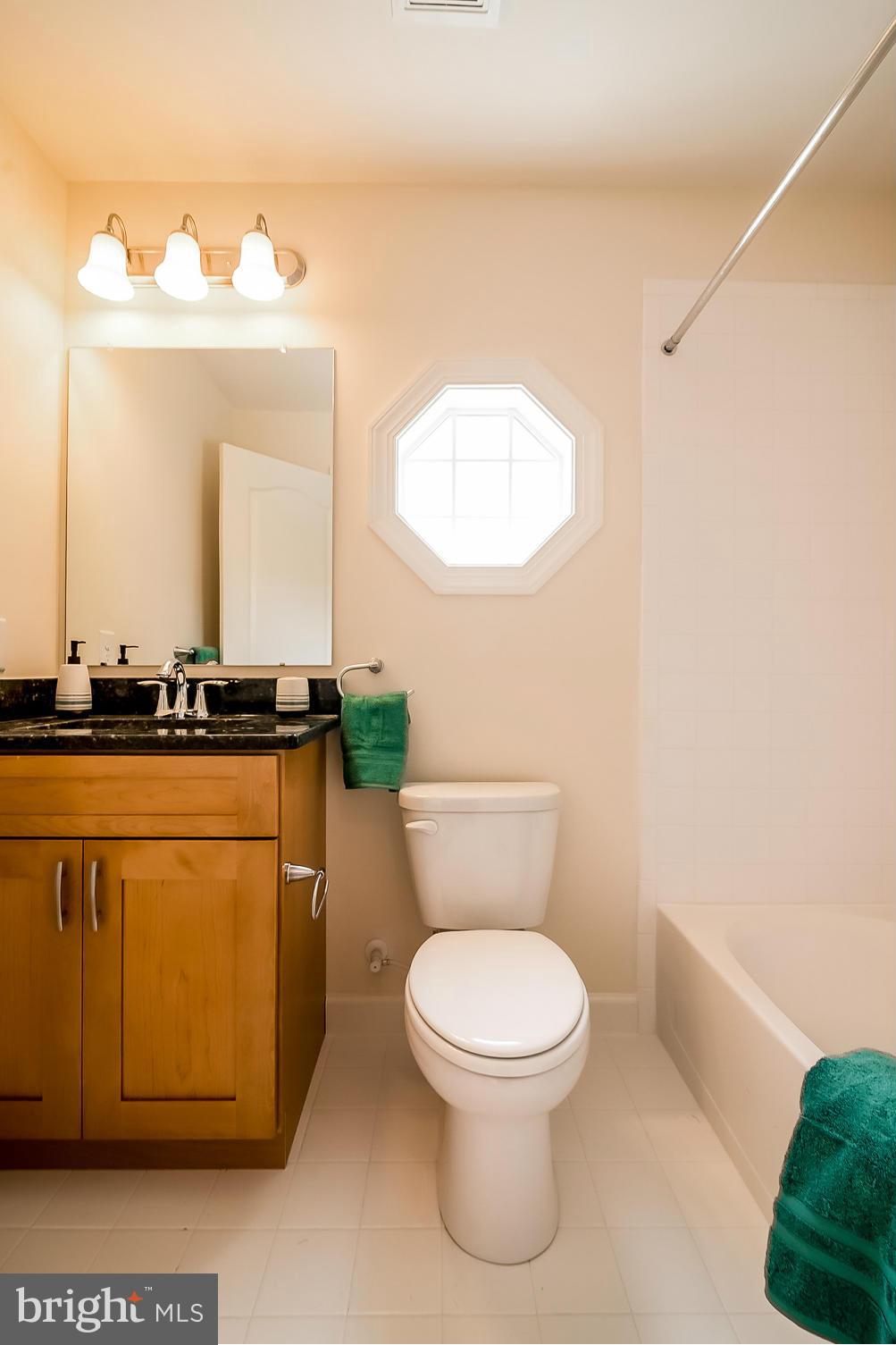 8325 Jacobs Road West Severn, MD 21144 - Photo 21 of 27 HALL BATH WITH RAISED VANITY AND GRANITE