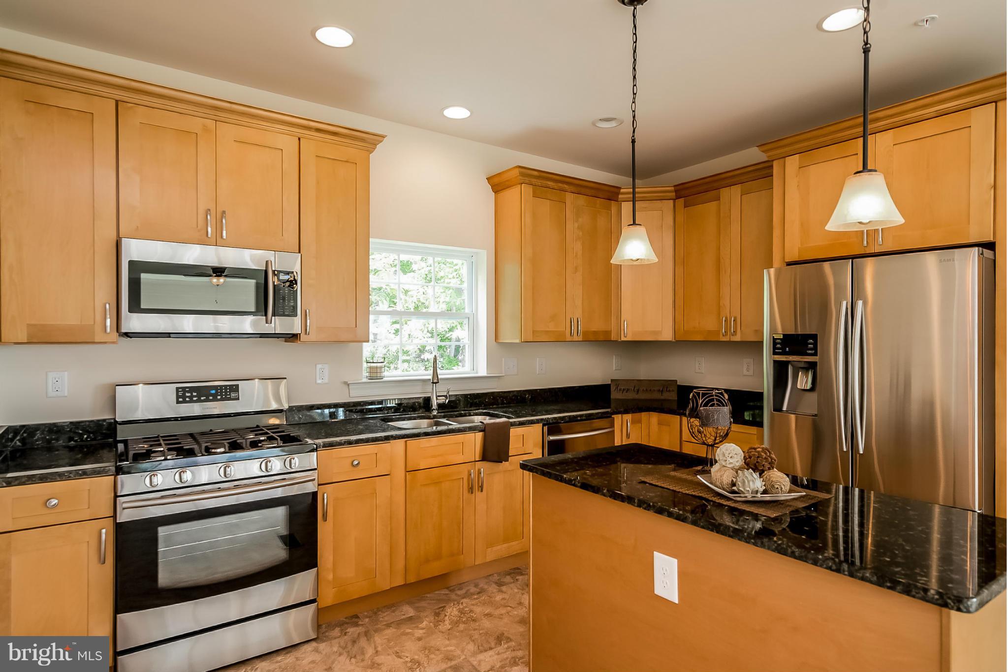 8325 Jacobs Road West Severn, MD 21144 - Photo 6 of 27 GOURMET KITCHEN W/GRANITE AND STAINLESS STEEL