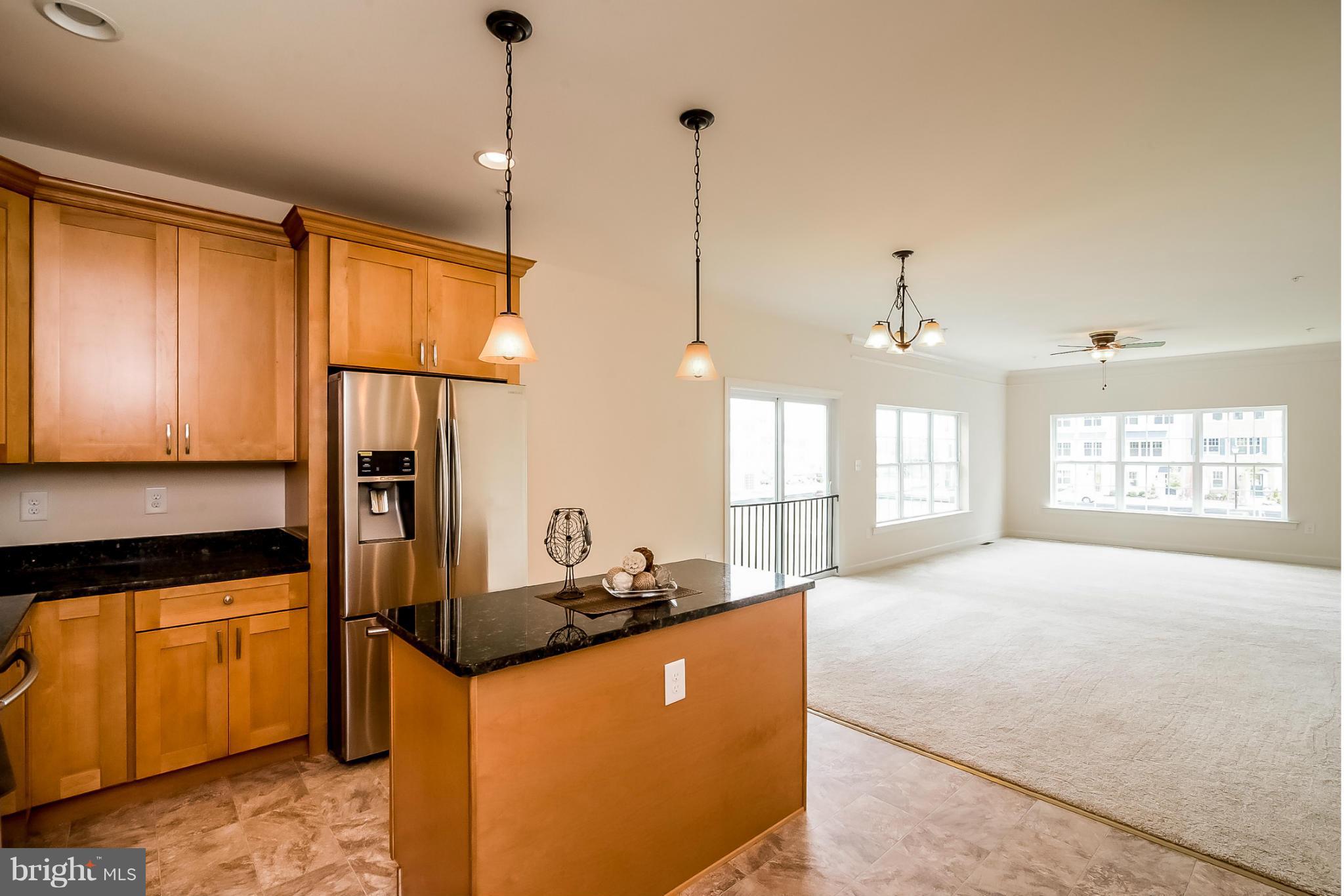 8325 Jacobs Road West Severn, MD 21144 - Photo 7 of 27 KITCHEN VIEW TO FAMILY ROOM AND DINING ROOM