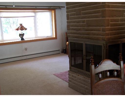 176 Election House Road Butler, PA 16001 - Photo 6 of 8 Living Room. Living Room with 3 sided stone fireplace large bow window, great for entertaining