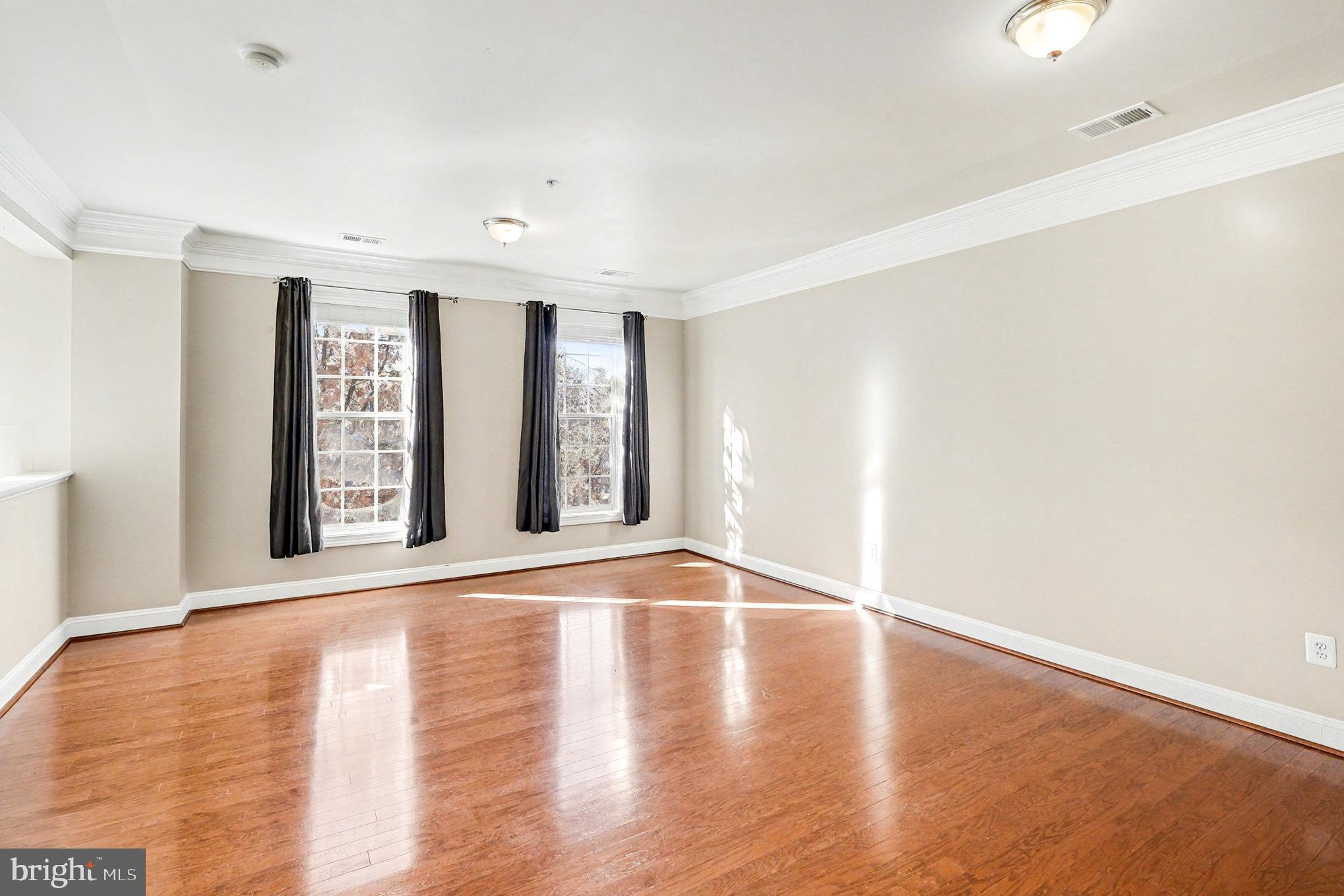2228 Merseyside Drive Woodbridge, VA 22191 - Photo 2 of 24 a view of an empty room with wooden floor and a window