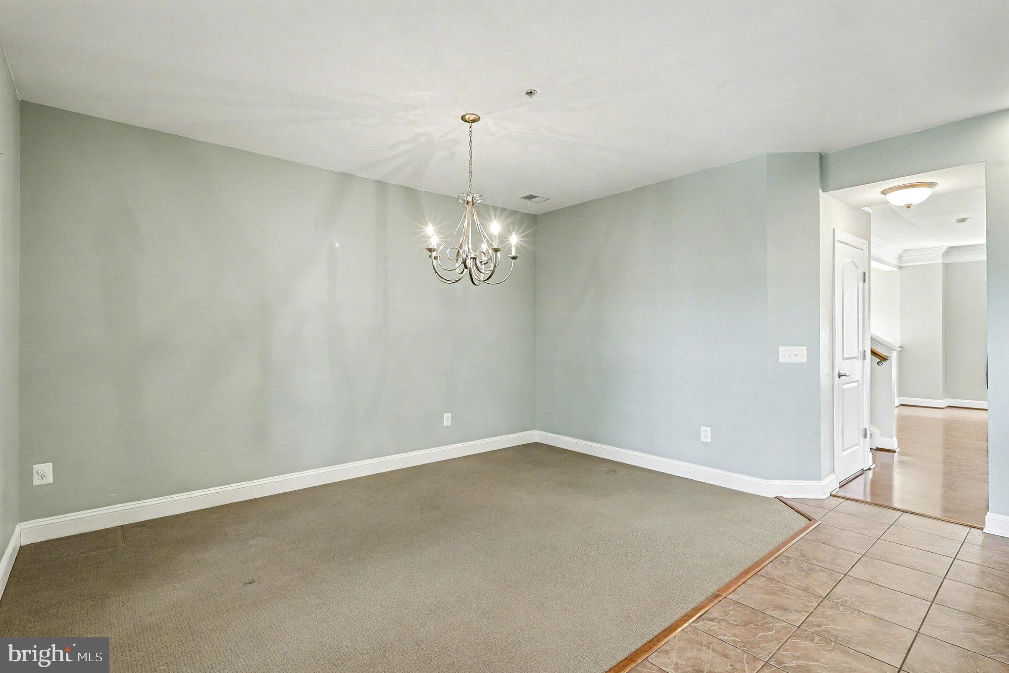 2228 Merseyside Drive Woodbridge, VA 22191 - Photo 4 of 24 en empty room with wooden floor and window