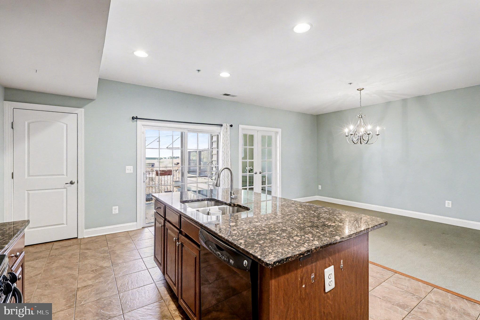 2228 Merseyside Drive Woodbridge, VA 22191 - Photo 8 of 24 a kitchen with center island table and chairs
