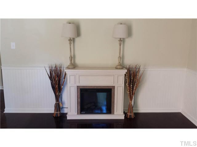 5586 Hamstead Crossing Raleigh, NC 27612 - Photo 4 of 21 a living room with furniture and a fireplace