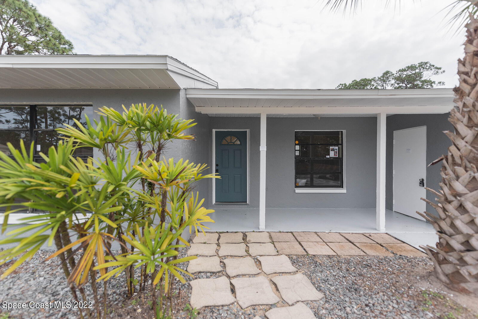 433 Tin Avenue Southwest Palm Bay, FL 32908 - Photo 1 of 20 Front Yard with Tropical Landscaping
