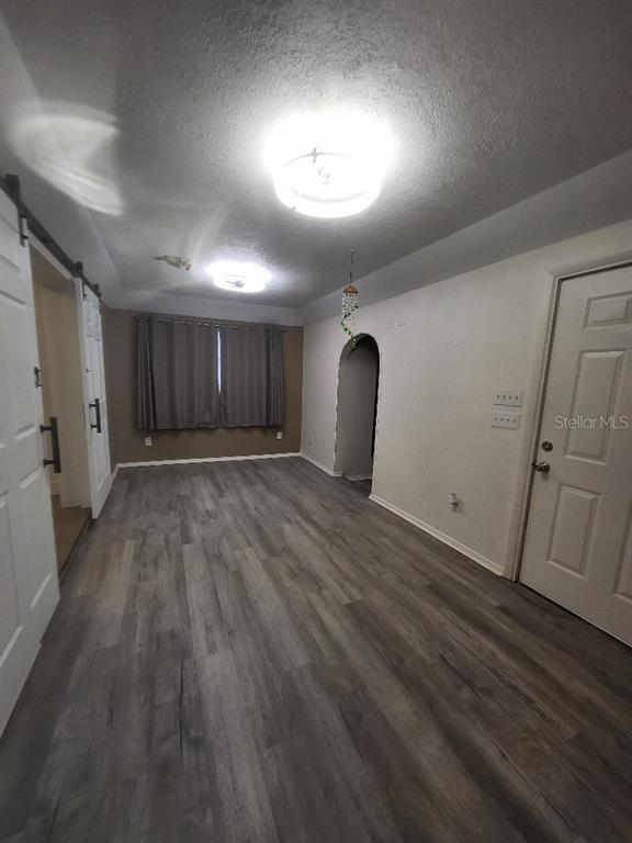 995 Emerald Drive Mount Dora, FL 32757 - Photo 11 of 49 a view of an empty room with wooden floor