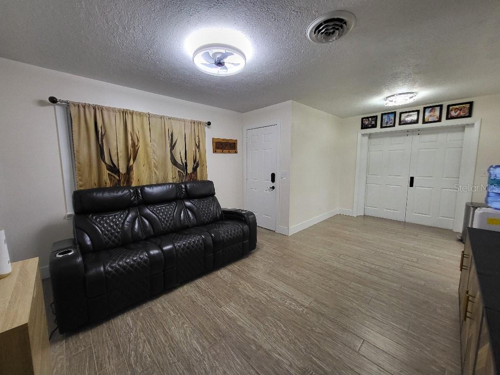 995 Emerald Drive Mount Dora, FL 32757 - Photo 12 of 33 a living room with furniture and a window