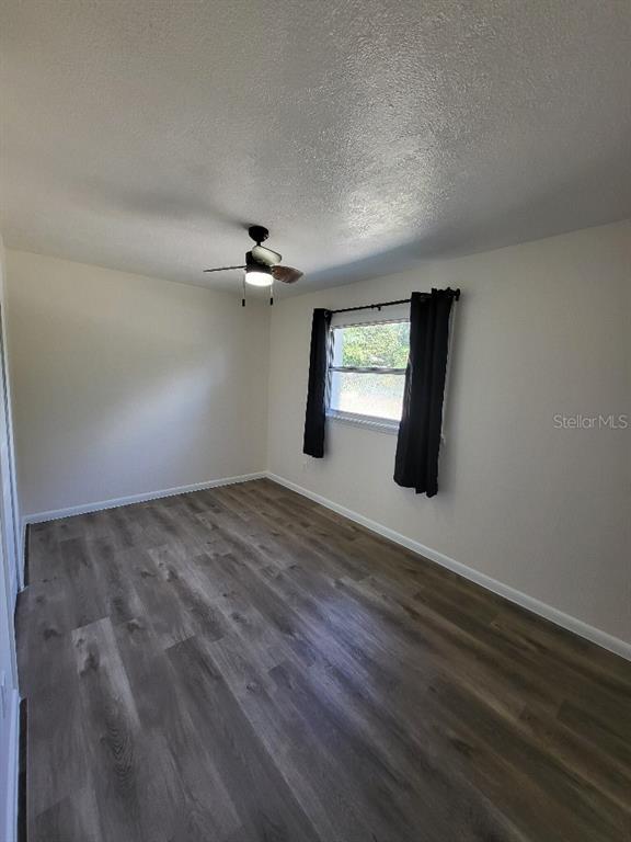 995 Emerald Drive Mount Dora, FL 32757 - Photo 13 of 33 a view of a livingroom with wooden floor and window