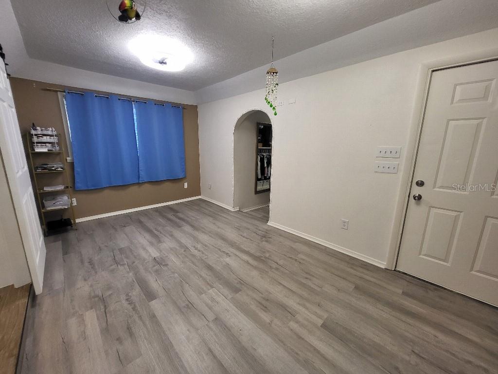 995 Emerald Drive Mount Dora, FL 32757 - Photo 14 of 33 wooden floor in an empty room with a window