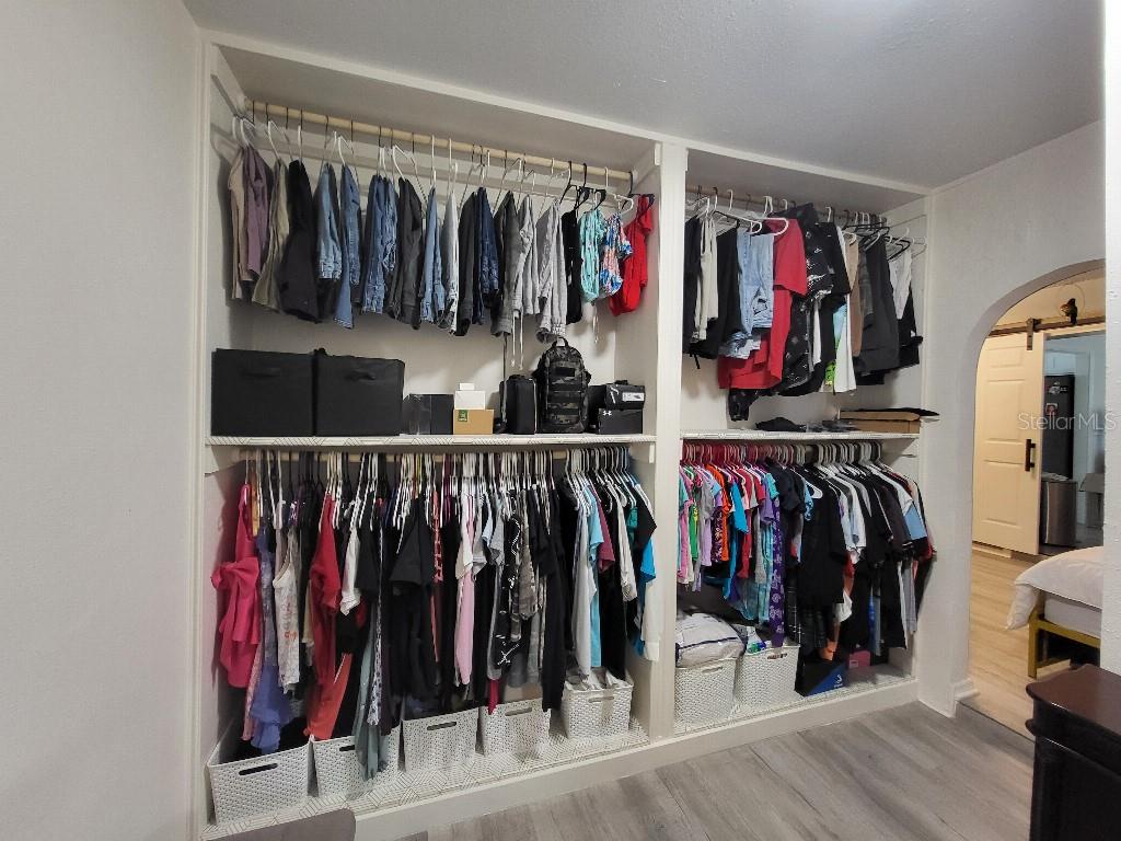 995 Emerald Drive Mount Dora, FL 32757 - Photo 16 of 33 a view of walk in closet with clothes