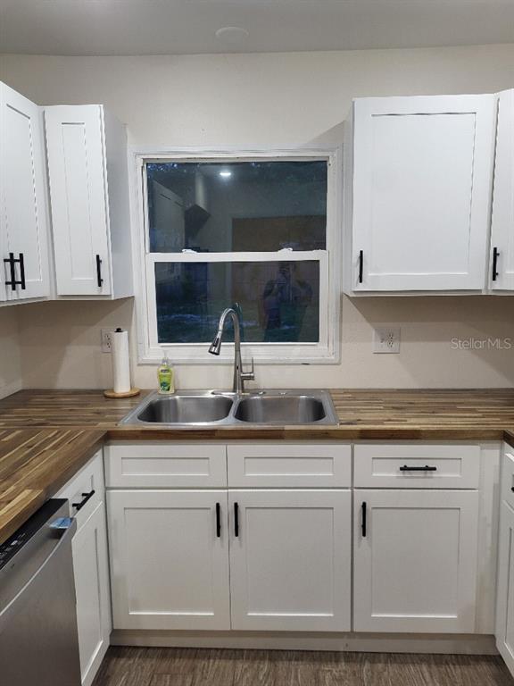 995 Emerald Drive Mount Dora, FL 32757 - Photo 35 of 49 a kitchen with white cabinets and sink
