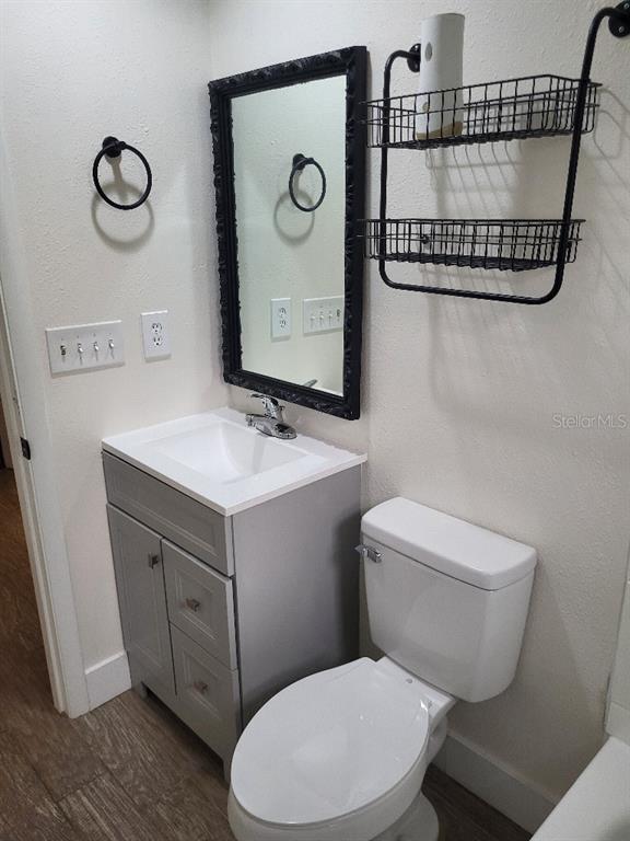 995 Emerald Drive Mount Dora, FL 32757 - Photo 42 of 49 a bathroom with a toilet sink and mirror