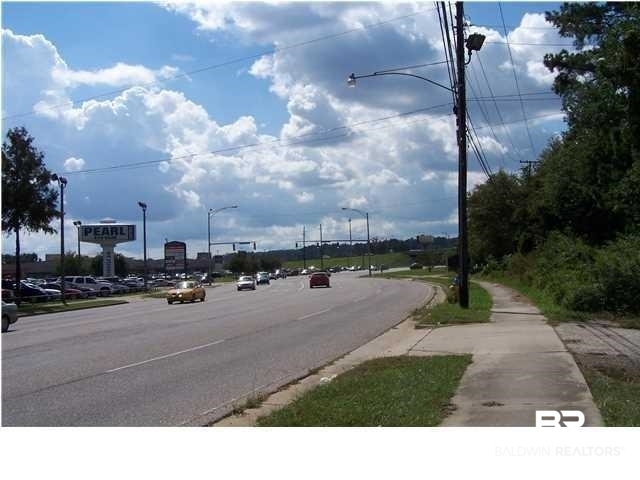 3346 Cottage Hill Road Mobile, AL 36606 - Photo 3 of 3 View of street with sidewalks, curbs, and street lights