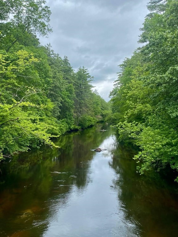 4 Savannah Way Amherst, NH 03031 - Photo 8 of 8 a view of a lake from a yard
