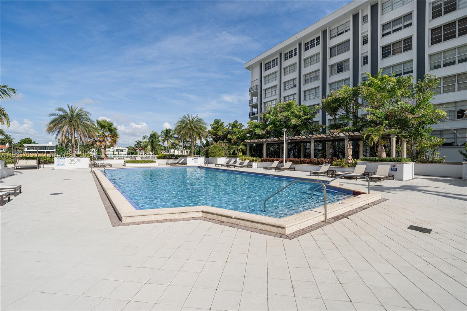 5600 Condominium Miami Beach, FL 33140 - Photo 25 of 27 a view of swimming pool with outdoor seating