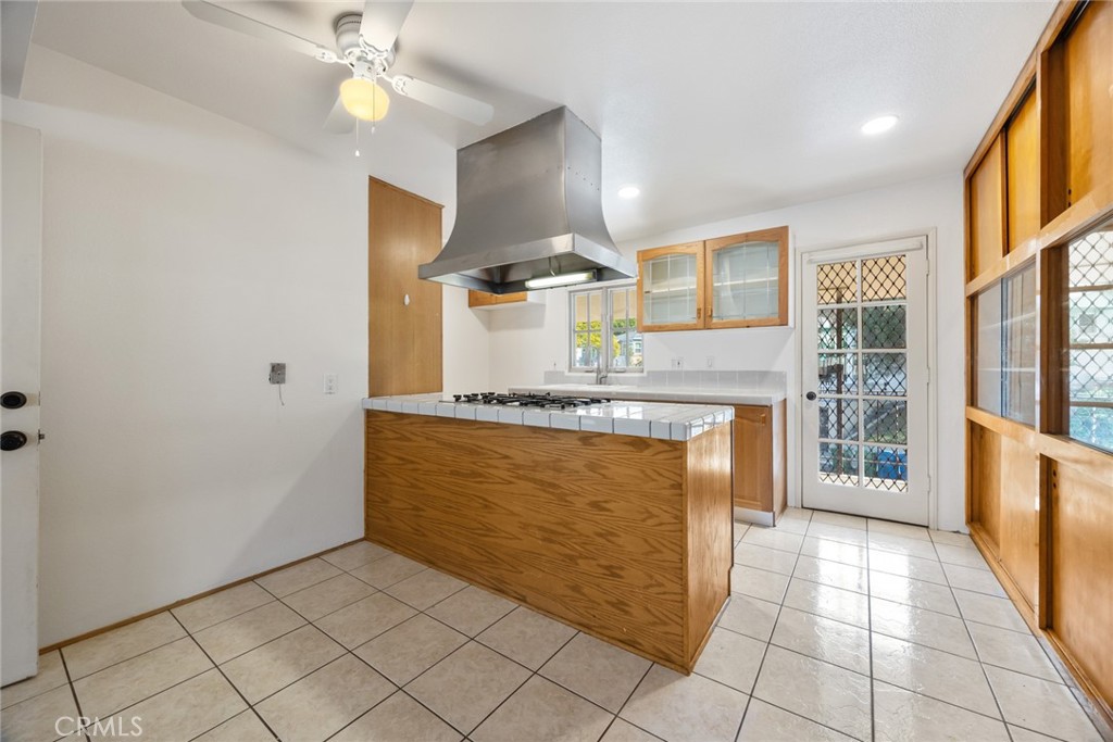 101 Hampden Terrace Alhambra, CA 91801 - Photo 14 of 46 a kitchen with stainless steel appliances granite countertop a refrigerator and a stove