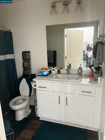 a living room with furniture chess board and a window