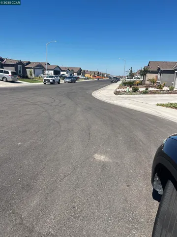 a view of a room with a flat screen tv and a stove
