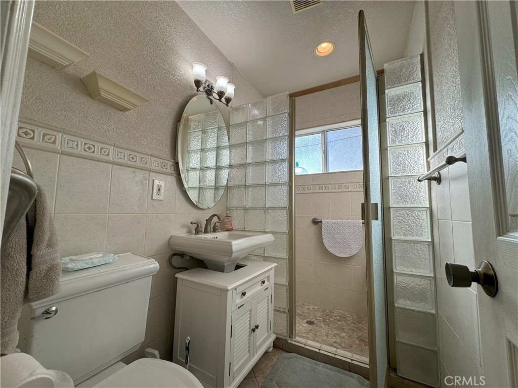 8429 Sheffield Road San Gabriel, CA 91775 - Photo 15 of 19 a bathroom with a sink a toilet and shower
