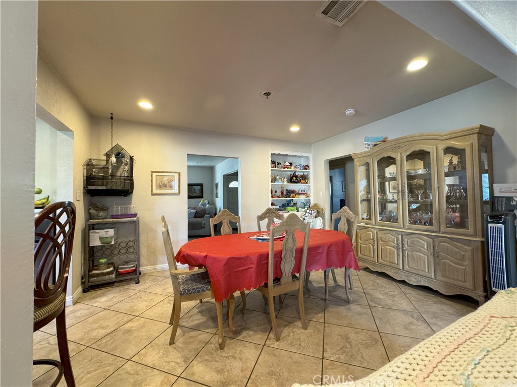 8429 Sheffield Road San Gabriel, CA 91775 - Photo 8 of 19 a living room with furniture a flat screen tv and kitchen view