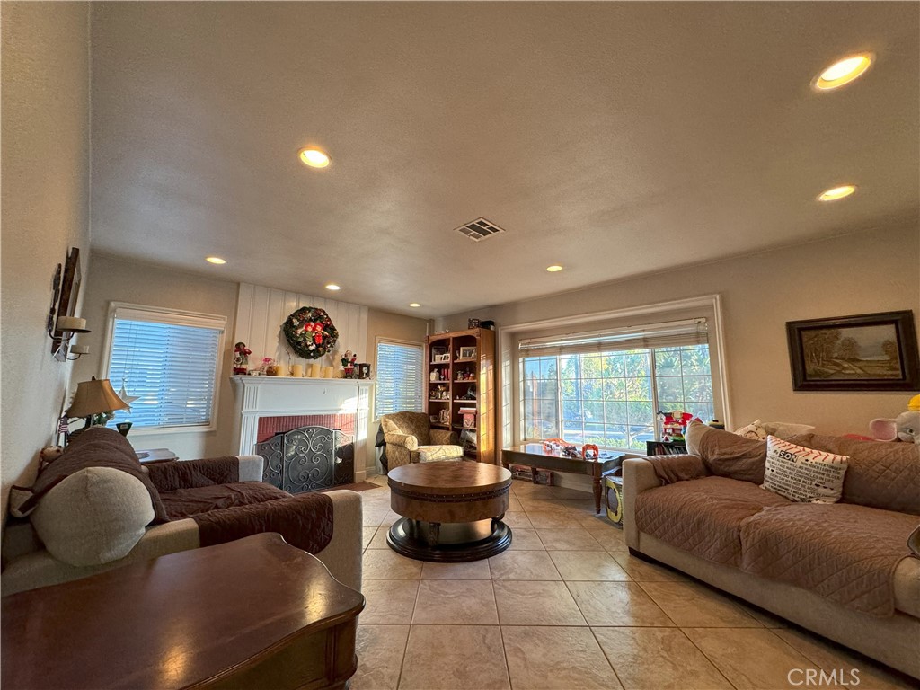 8429 Sheffield Road San Gabriel, CA 91775 - Photo 10 of 19 a living room with furniture a large window and a flat screen tv