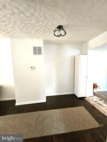 a view of a livingroom with wooden floor