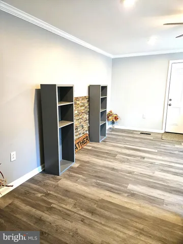 a view of a livingroom with wooden floor