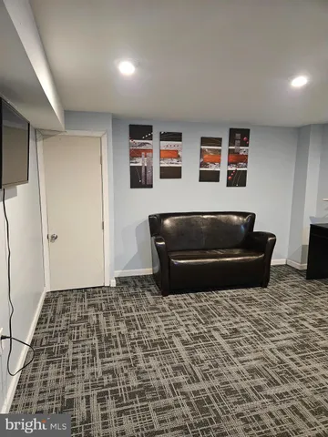 a living room with a couch and a fireplace