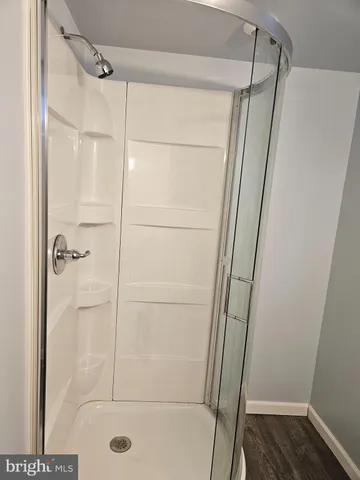 a white toilet sitting next to a bathroom sink