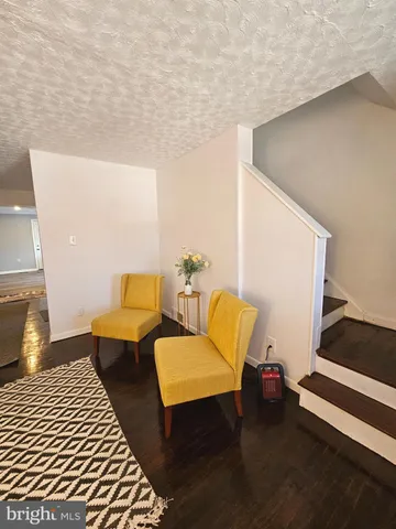 a blue bench sitting in front of a house