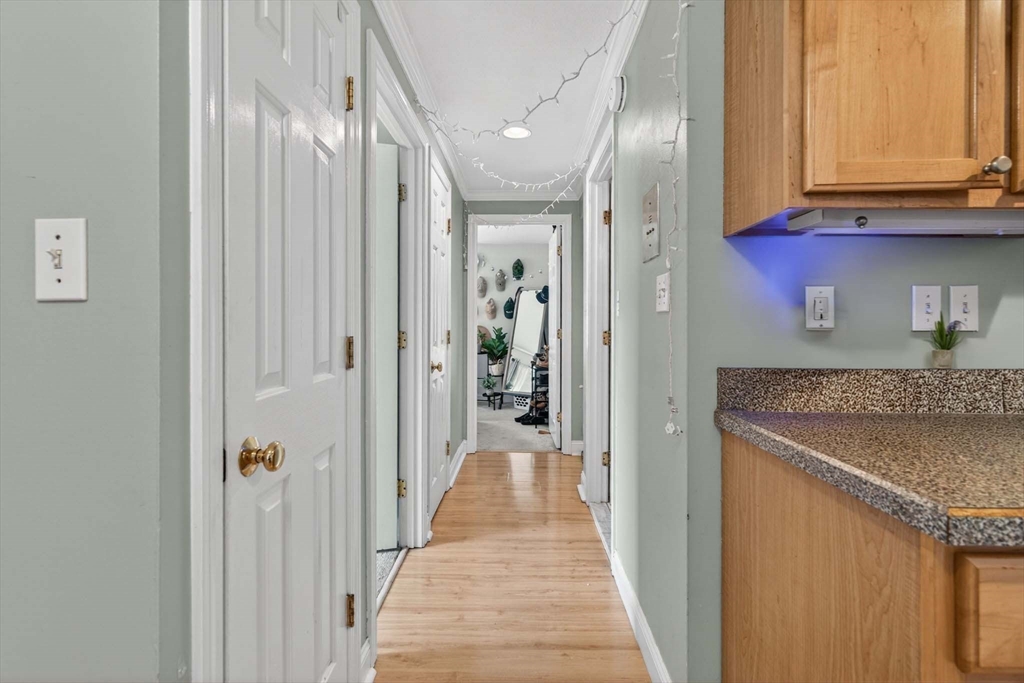 588 Main Street, Unit 3D Stoneham, MA 02180 - Photo 11 of 22 a view of a kitchen from the hallway