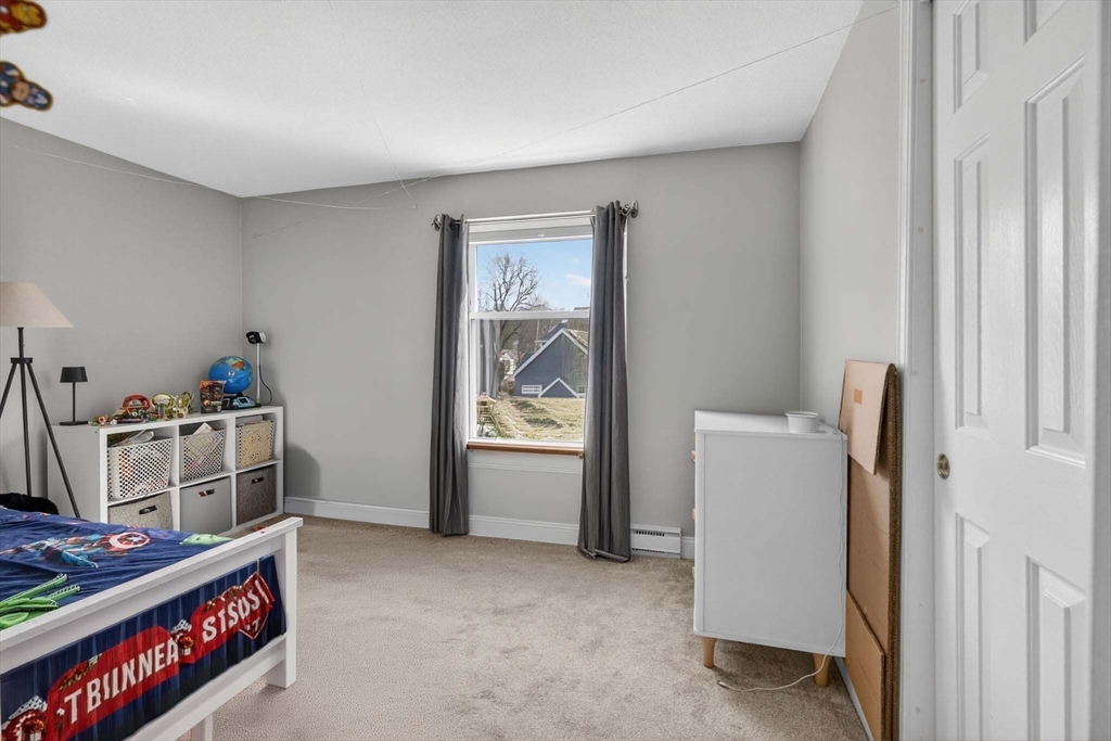 588 Main Street, Unit 3D Stoneham, MA 02180 - Photo 13 of 22 a view of room with fridge and window