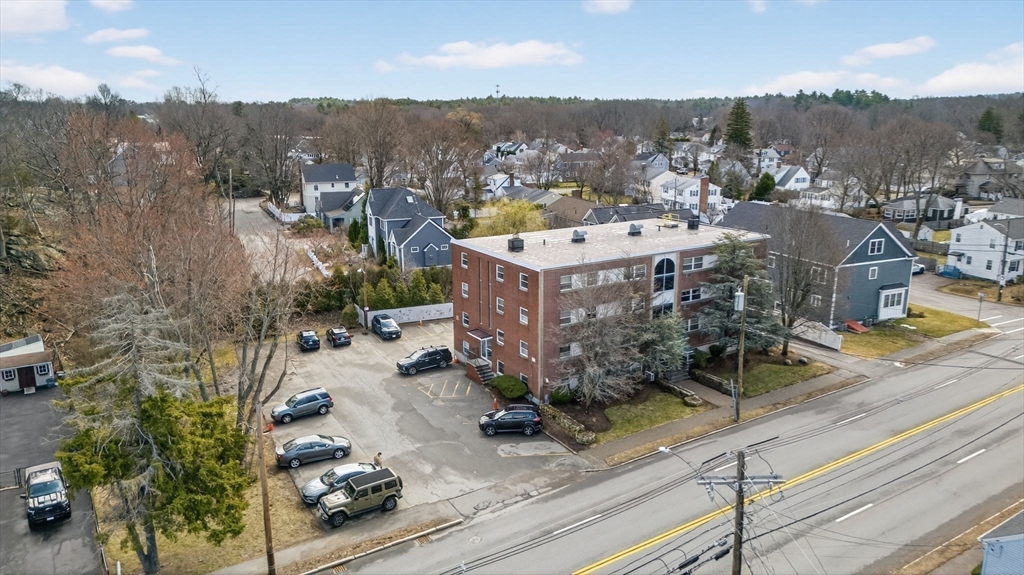 588 Main Street, Unit 3D Stoneham, MA 02180 - Photo 19 of 22 a view of a city with tall buildings