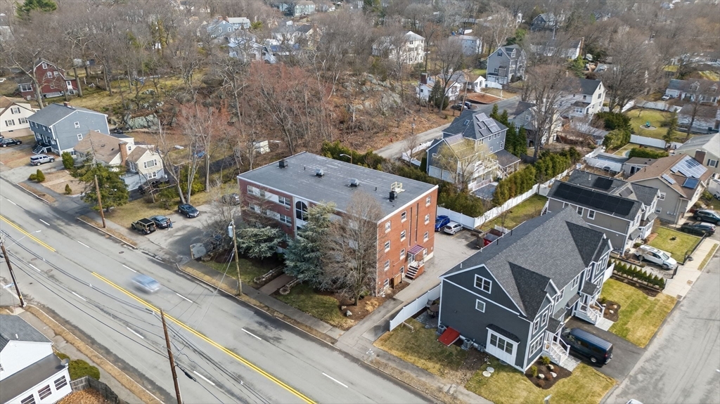588 Main Street, Unit 3D Stoneham, MA 02180 - Photo 22 of 22 an aerial view of residential houses with outdoor space