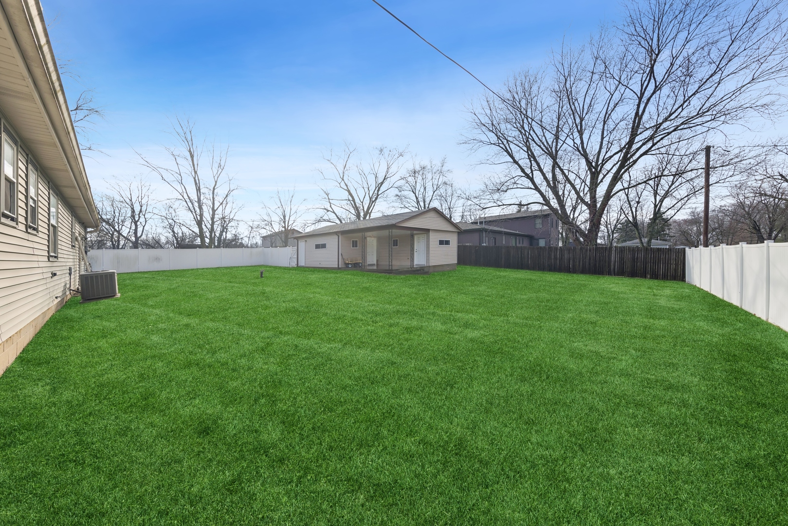 213 South Anderson Road New Lenox, IL 60451 - Photo 5 of 32 a view of a back yard of the house