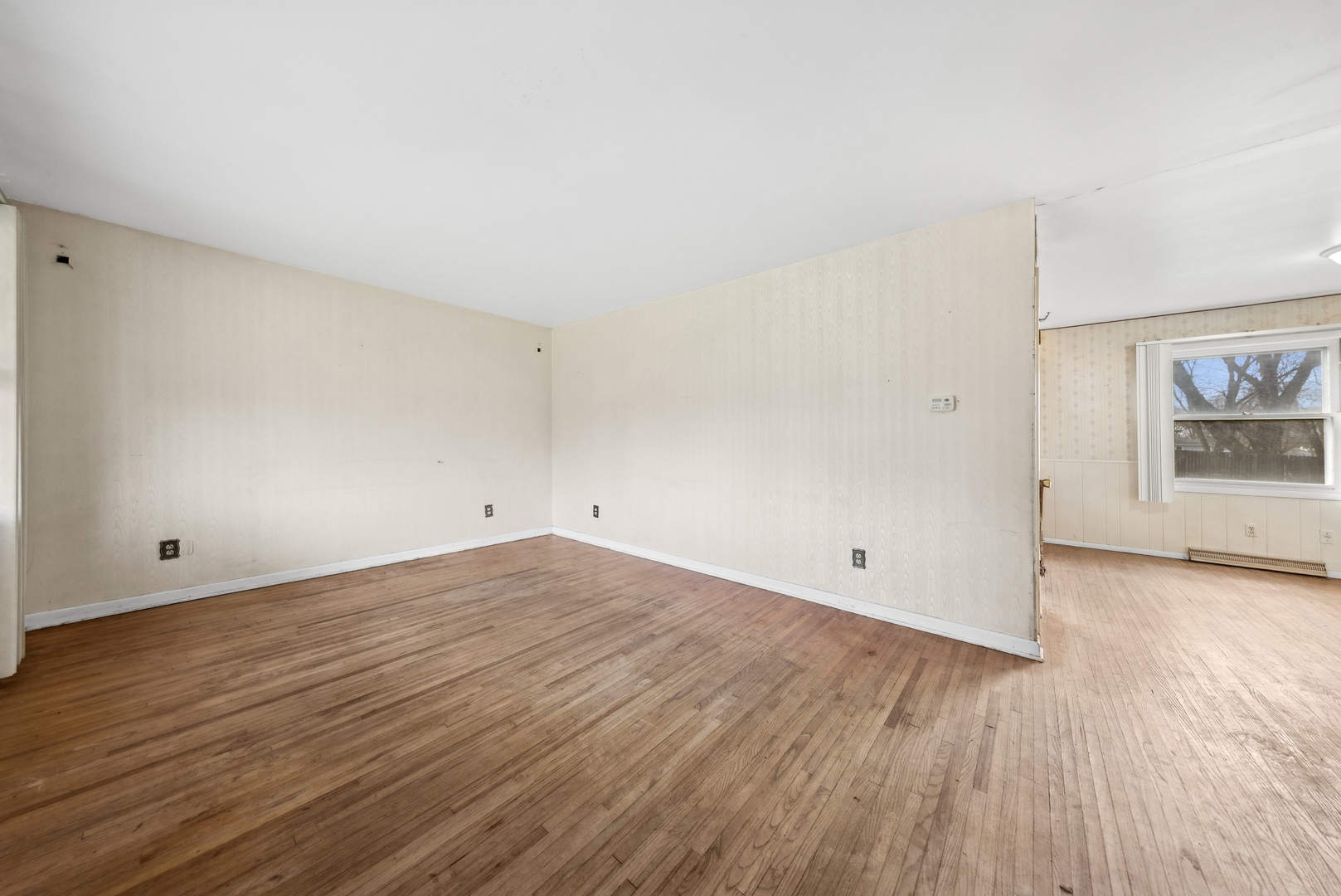 213 South Anderson Road New Lenox, IL 60451 - Photo 8 of 32 a view of empty room with wooden floor and fireplace