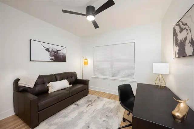 a living room with furniture and a window