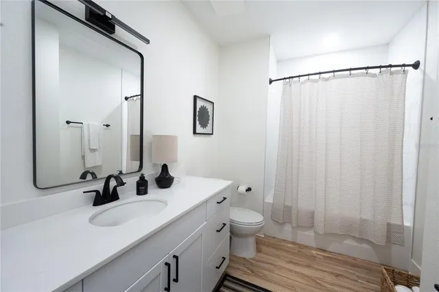 a bathroom with a double vanity sink and mirror